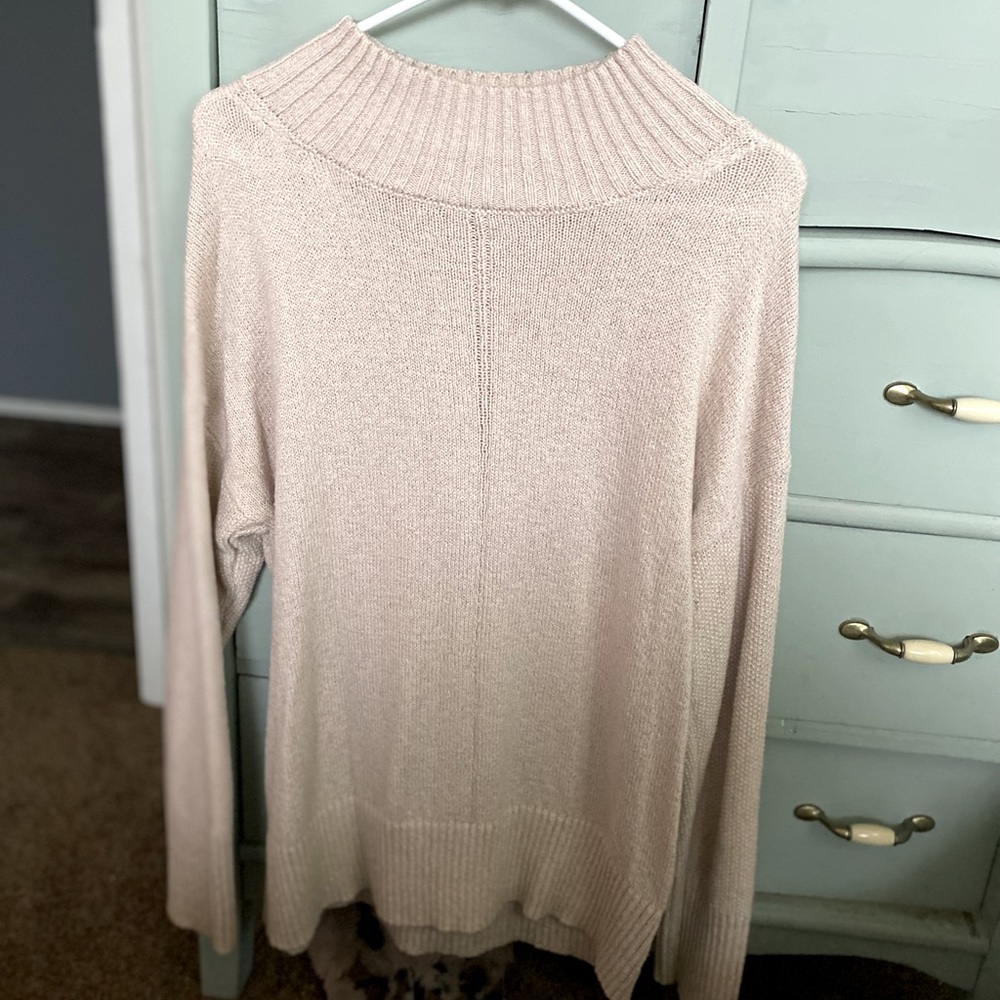 Mock neck/high neck stitch sweater with ribbing detail. Champagne color.